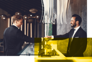 Friendly,Greeting.,Positive,Bearded,Young,Receptionist,Standing,At,The,Desk