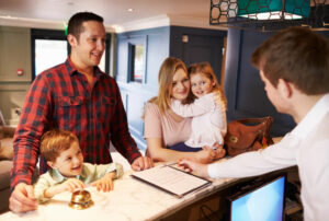 family at Reception desk