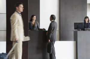 Customer service representative helping businessman